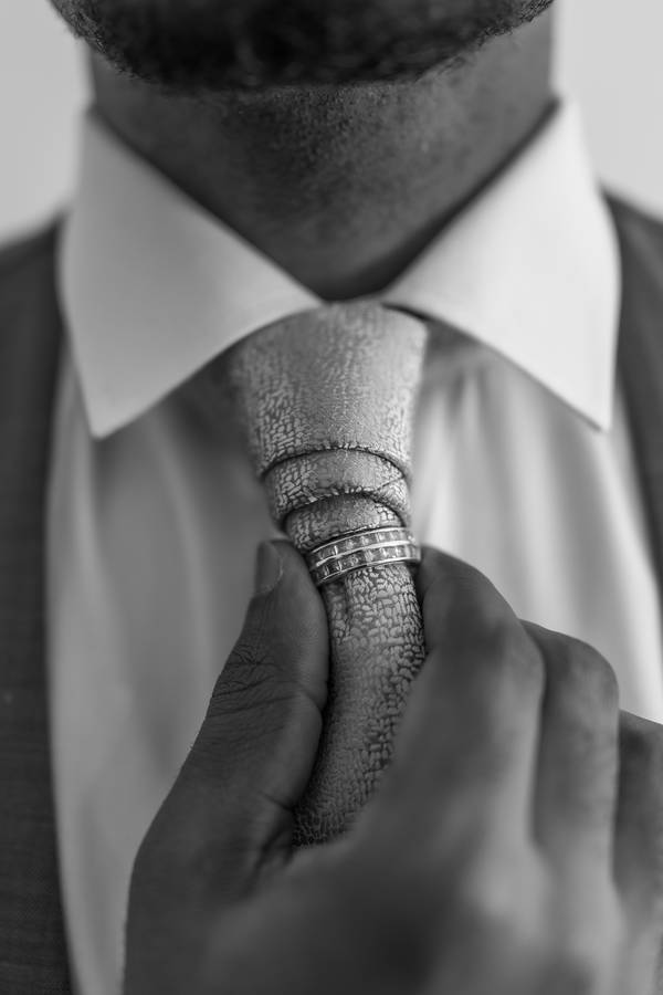 Groom adjusting his tie — wedding in Porto