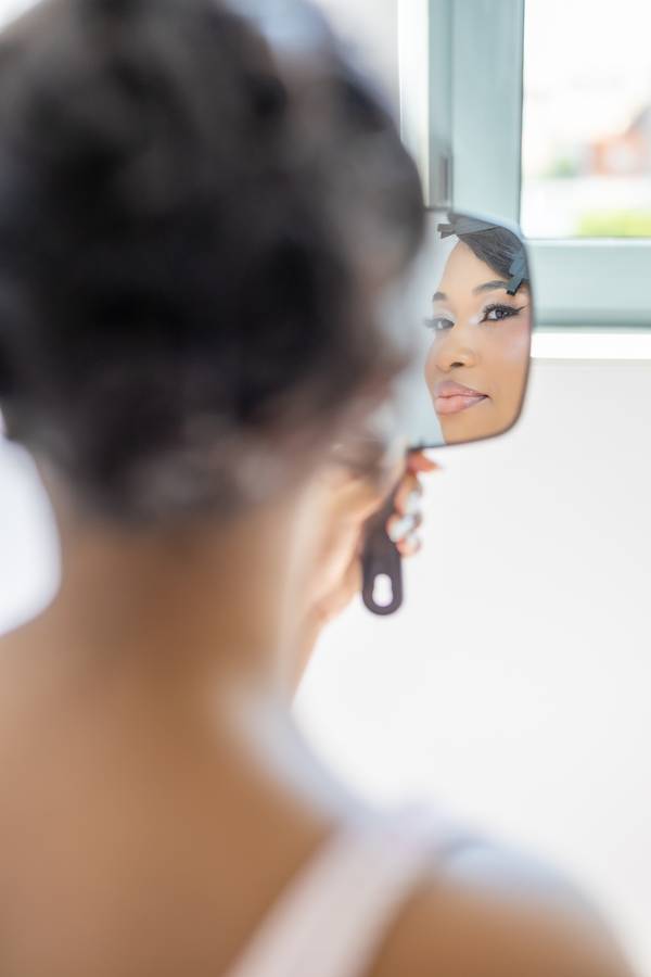 Bride seen in a hand mirror — wedding in Lisbon