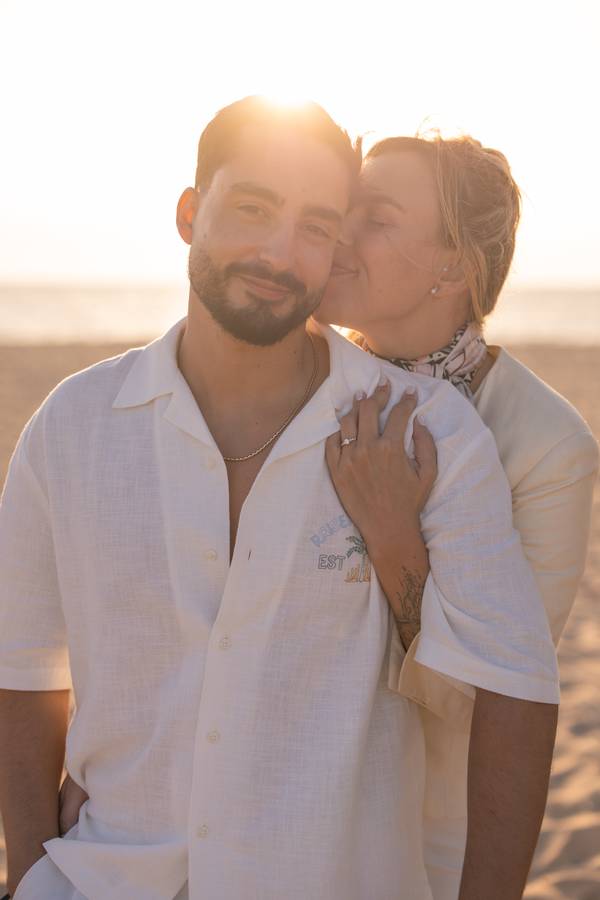 Couple embracing at sunset on the beach — wedding in Melides