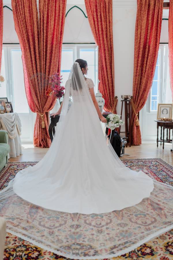 Bride from behind in a historic drawing room — wedding in the Ducal Palace of Vila Viçosa