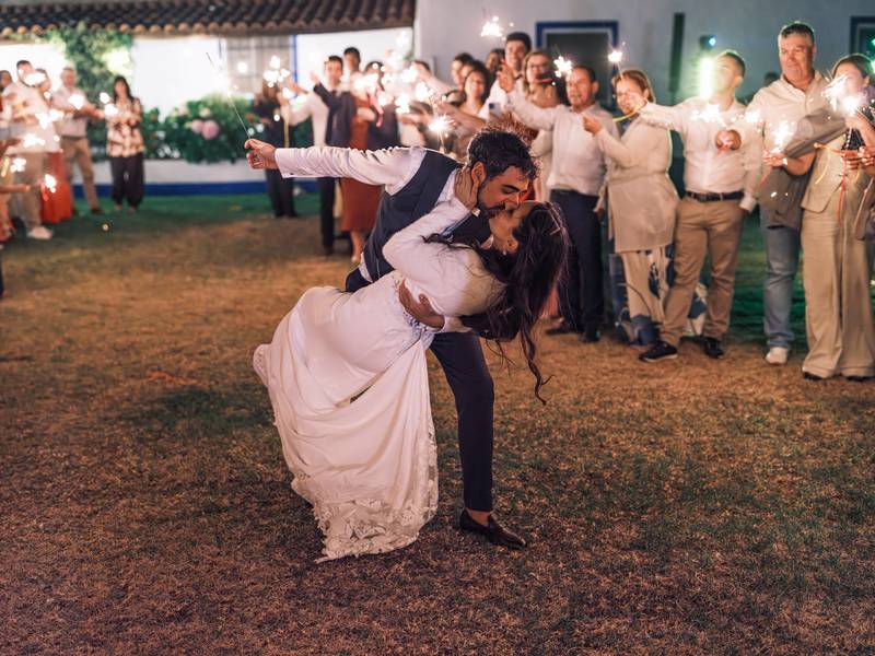 Couple kissing during a sparkler send-off — wedding in the Alentejo
