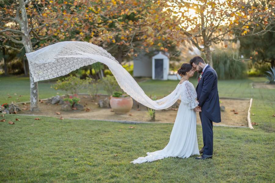 Lace veil blowing in the wind in the garden — wedding in Óbidos