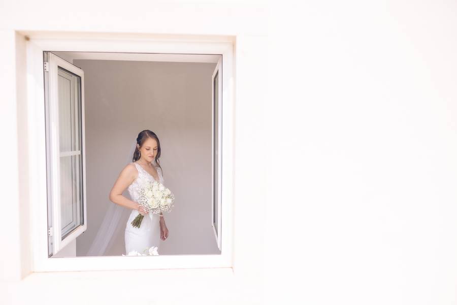 Bride at the window — wedding in Setúbal